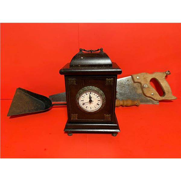 vintage battery-operated wooden mantel clock with a storage drawer saw and fire place coal shovel