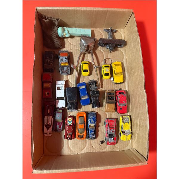 collection of assorted, used die-cast toy vehicles, primarily from the Hot Wheels brand.