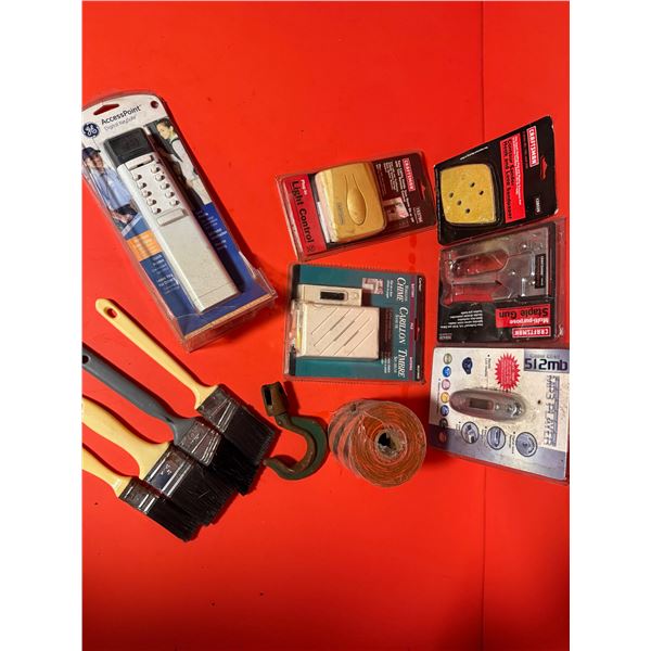 collection of assorted tools and electronics