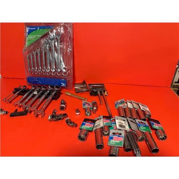 collection of mechanic's tools, primarily wrenches and sockets