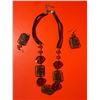 Image 1 : necklace and earring set featuring reddish-brown faceted beads and dark, wire-wrapped square cage-st