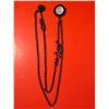 Image 1 : layered chain necklace with a circular pendant and pink bead accents