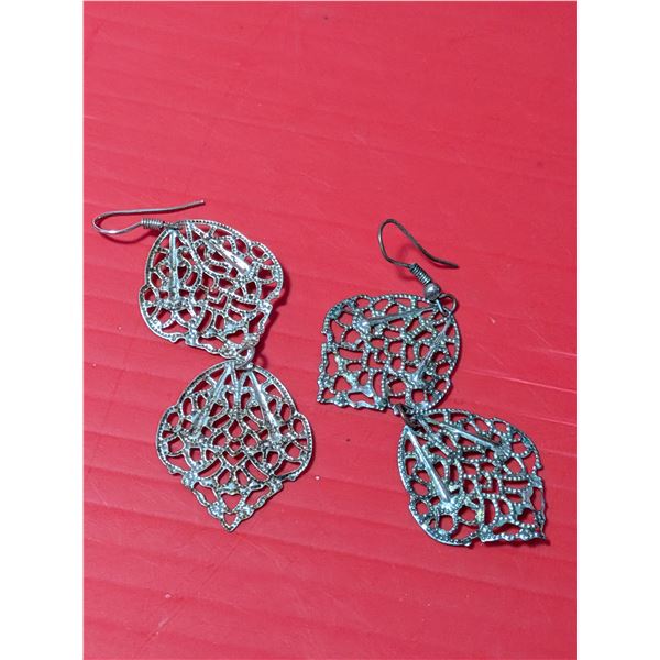 A pair of intricate filigree silver drop dangle earrings