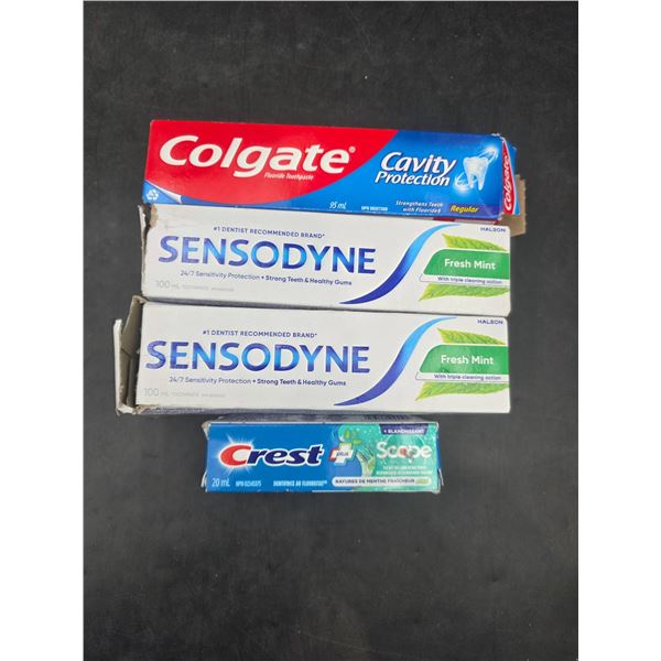 Lot of 4  Assorted Toothpaste Tubes by Colgate, Sensodyne, and Crest
