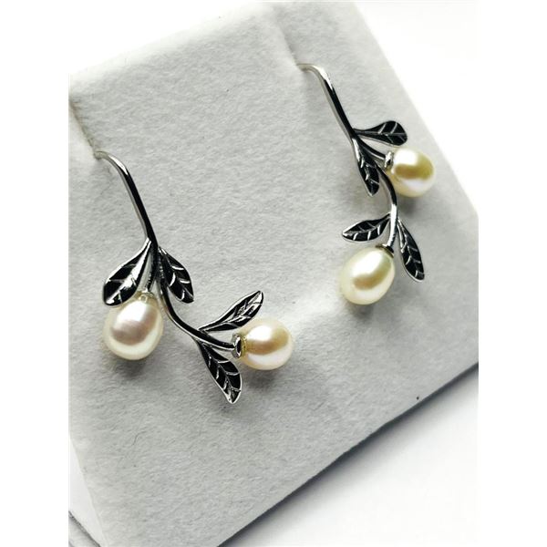 Sterling Silver Freshwater Pearl 7.8-6.1mm Earrings with Ear Wire, W/A $180.00.