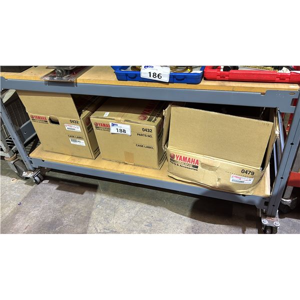 SHELF OF ASSORTED YAMAHA PARTS- OUTBOARD EXHAUST MUFFLER, OIL PAN & GUIDE, EXHAUST