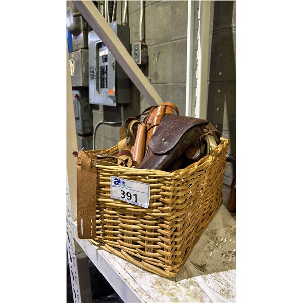 BASKET OF ASSORTED LEATHER GUN HOLSTERS