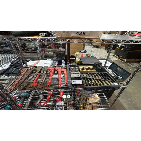 SHELF OF ASSORTED TOOLS INCLUDING; DRILL BITS, PIPE WRENCHES, SOCKET SET & MORE