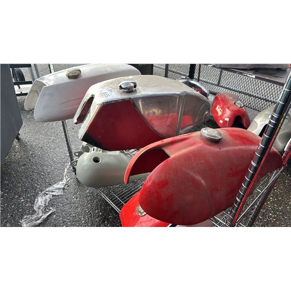 SHELF OF ASSORTED MOTORCYCLE FUEL TANKS