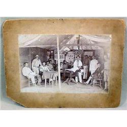 ANTIQUE MOUNTED PHOTO OF EARLY MILITARY BARBER SHO