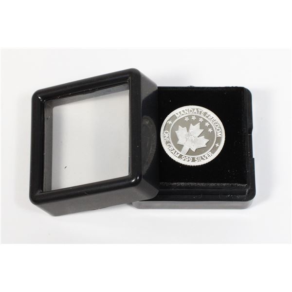 1 GRAM SILVER ROUND IN GEMSTONE DISPLAY CASE