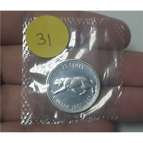 1967 Diving Canadian Silver 25 Cents. There is a Rotated Die, so it appears that the bobcat is Divin