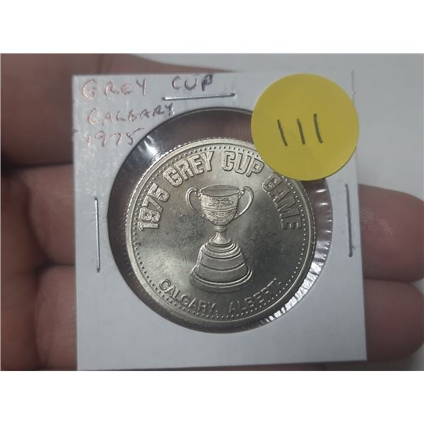 1975 Grey Cup medal held in Calgary.