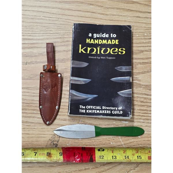 Throwing knife with sheath and book