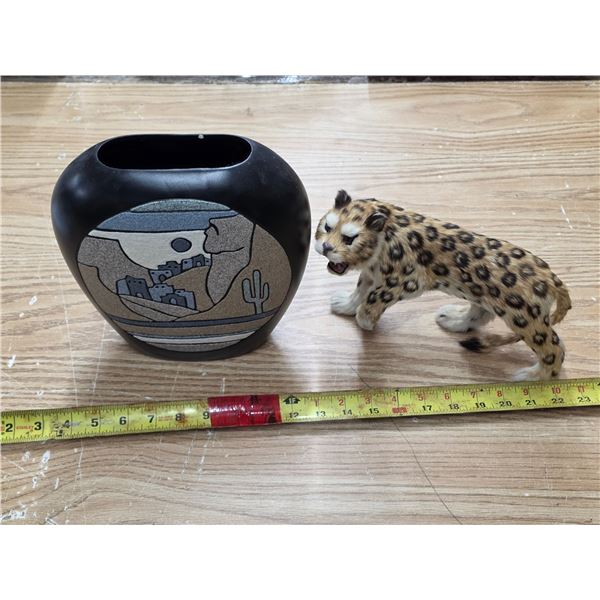 Jaguar statue and vase