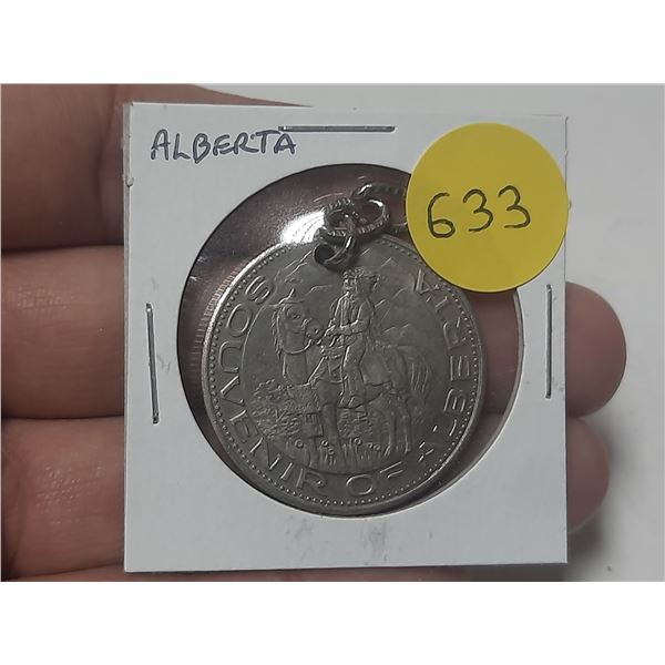 Souvenir of Alberta medal. First Nations Chief on horseback/map of Alberta. Hanger for suspension. U