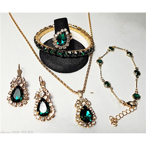 35)  SUITE OF ROSE GOLD TONE WITH EMERALD