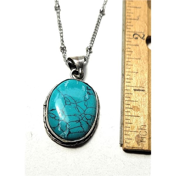 14)  NATURAL BEZEL SET OVAL TURQUOISE