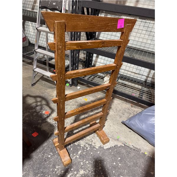 Blanket rack measures 25 inches wide 47 1/2 inches tall
