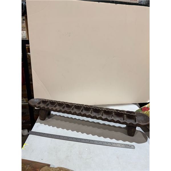 carved wooden mancala game board.