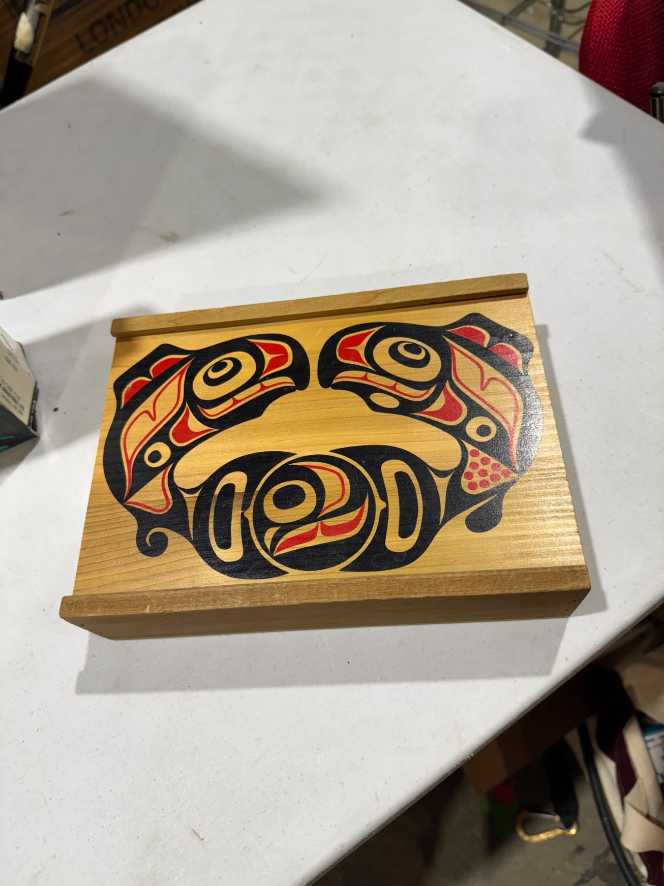 First Nations wood box featuring traditional Haida-style salmon artwork.