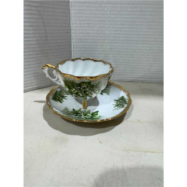Footed, teacup, and saucer