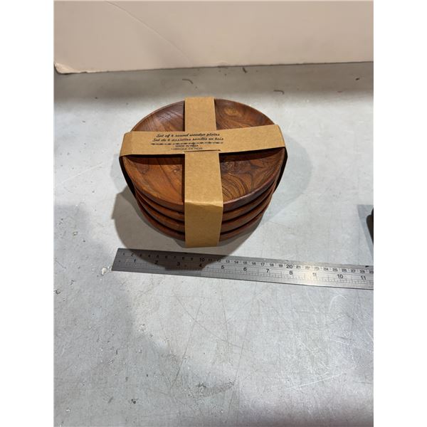 Set a four round wooden plate plates