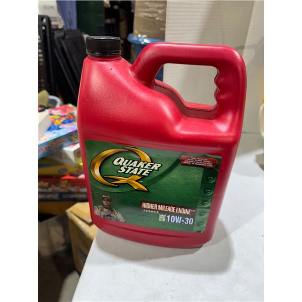 Quaker State oil 10W-30 almost half full