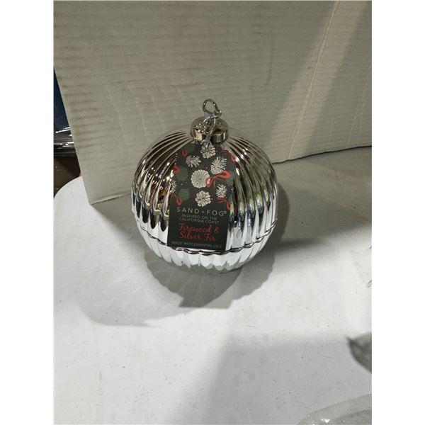 Sand and fog, firewood, and silver fur candle