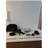 Image 1 : Panasonic Lumix DMC-FX100 Digital Camera With Camera Adapter, Sony Handycam Camcorder