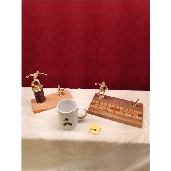 Lot # 1038: Bowling Trophy Collection: Two golden bowler trophies on wooden bases, a cribbage board 