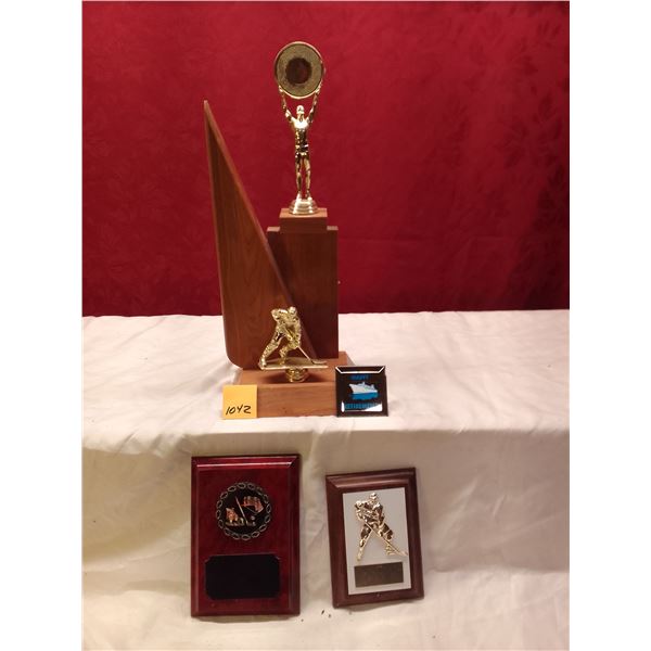 Lot # 1042: Hockey Retirement Trophy Collection: Tall victory figure trophy, player figurine, "Happy