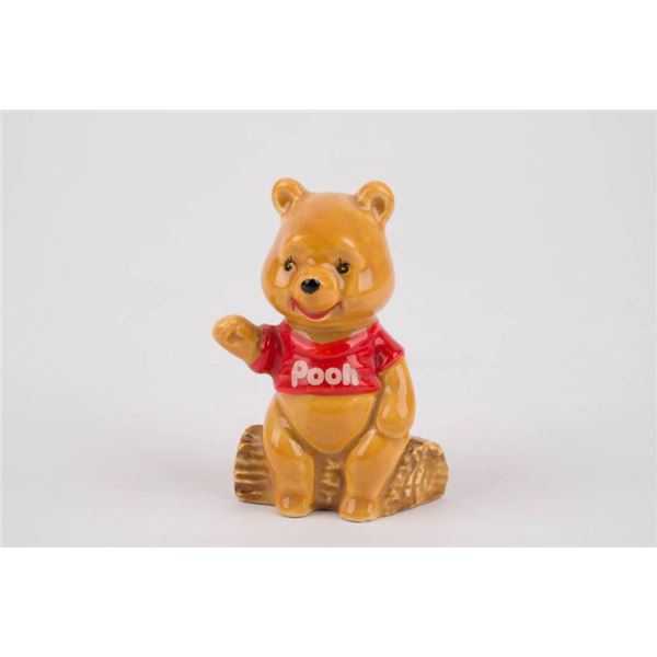 A Winnie the Pooh Ceramic Figurine by Enesco.