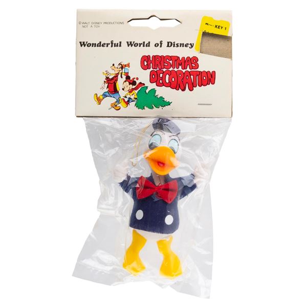 A Donald Duck Christmas Ornament in Original Packaging.