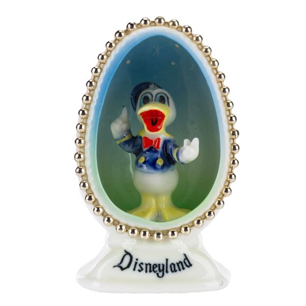 A Disneyland Donald Duck China Egg Figurine.