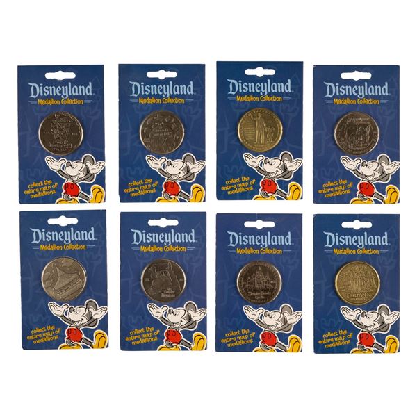 A Disneyland Medallion Collection and Map.