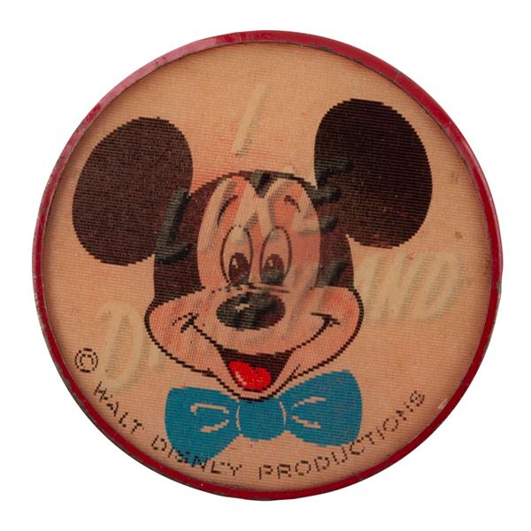 A Disneyland Art Corner Mickey Lenticular Button.