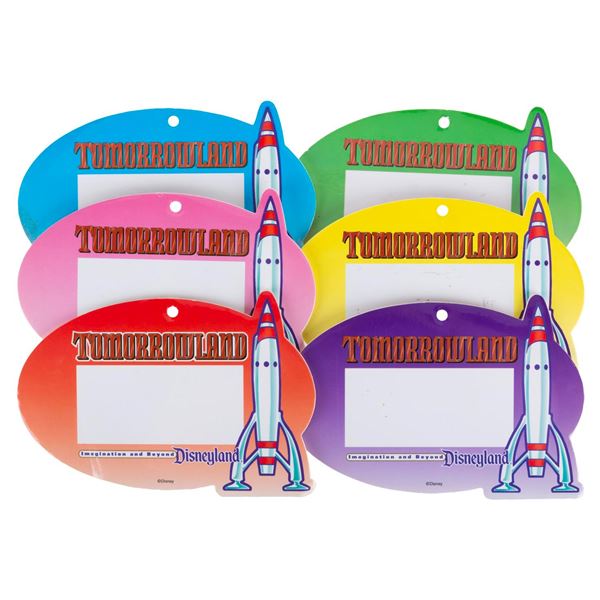 A Set of New Tomorrowland Press Badges.