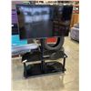 Image 1 : GLASS TV STAND W/ TV AND REMOTE