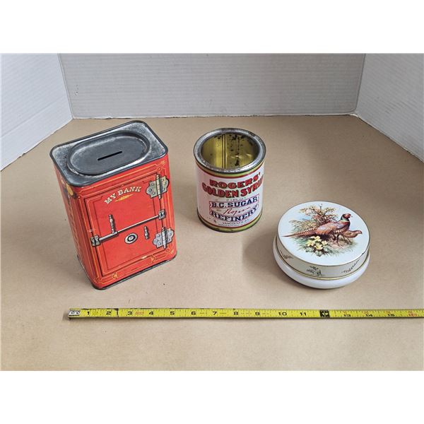 (3) Vintage Tins (Nesquik Penny Bank, Rogers Syrup, Riley’s)