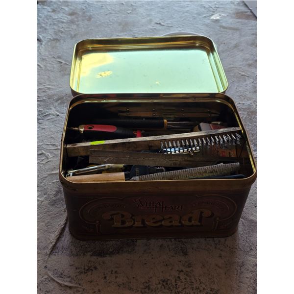 Bread tin with tools and hardware