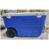 Image 5 : Coleman Cooler. Has a drain spout in bottom, two back wheels and handle for towing. Good condition