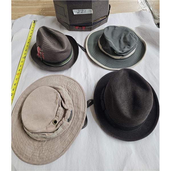 A couple of men’s hats in a hat box plus one Tilley hat and another similar one, all large 