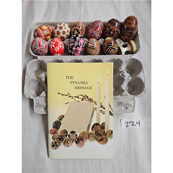 Eleven Ukrainian Easter eggs (4 wooden), one Easter egg stand and book on Ukrainian Easter Eggs (pys