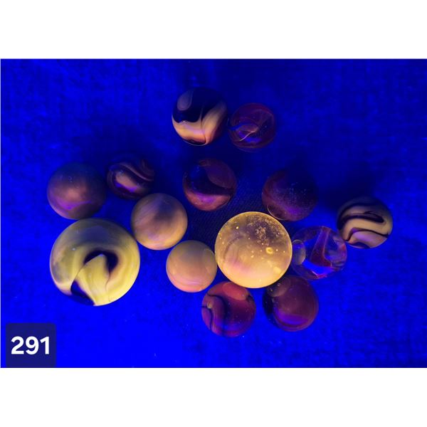 Uranium glass marbles - glow! Hard to find.