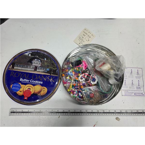 Tin full of sewing supplies