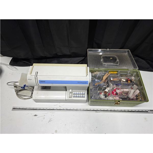 Tipmatic sewing machine and sewing box with contents