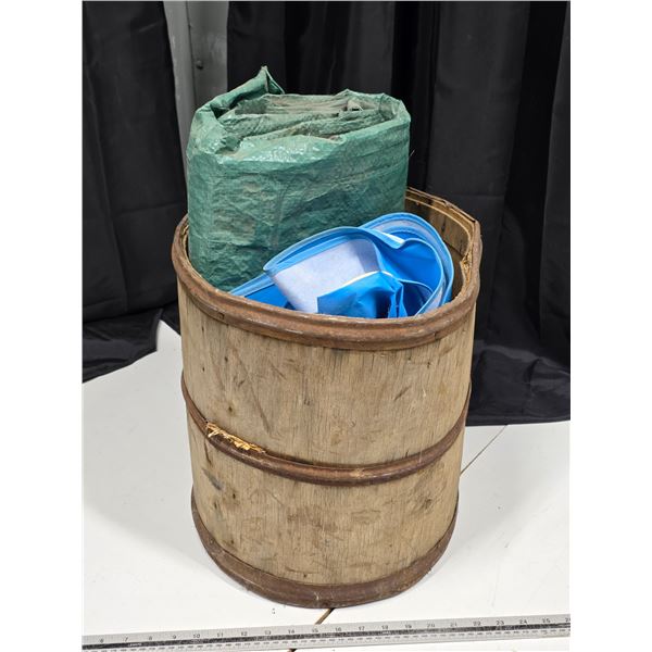 wood barrel with tarp and shower curtain