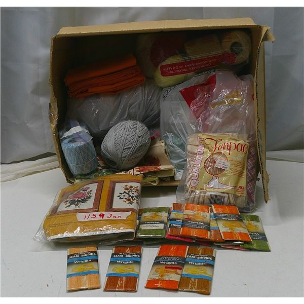 box of yarn, fabric, and seam binding