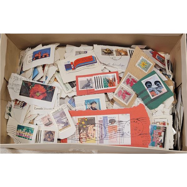 Canadian postmarked stamps - shoe box 1/2 full